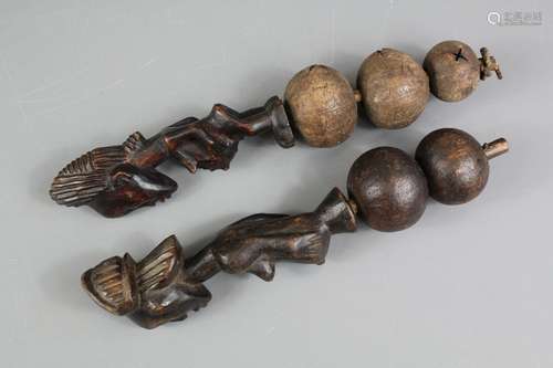 Two African tribal carved gourd rattles approx 26 cms