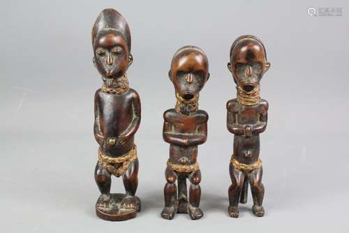 Three African Kongolese carved figurines; the figures approx 18 and 22 cms respectively