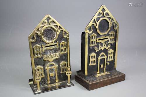 Two 19th century brass and cast metal money banks, one raised on a square base, approx 18