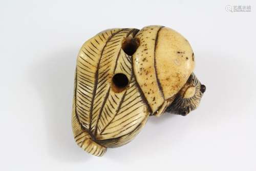 A Japanese Netsuke; the netsuke depicting a mouse feeding, approx 45 x 40mm, unsigned