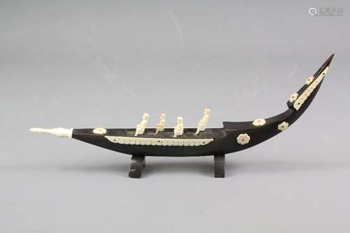 South Asian boat carving; the horn and bone carving depicting four Chinese boat passengers, approx 29 x 3 x 12 cms