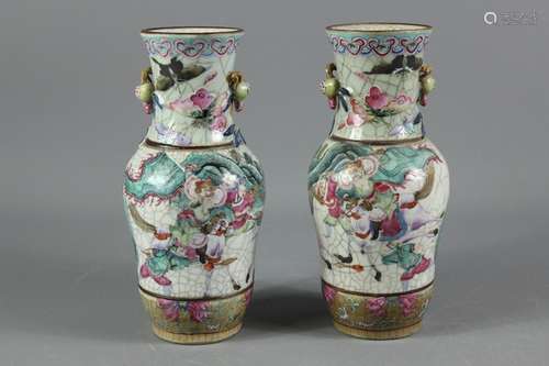 A Pair of Early 20th Century Chinese vases; the crackle glaze vases painted with mounted warriors in landscape setting, with pomegranate handles, brown incised character marks to base (Chenghua Nian Zhi), approx 25 cms h