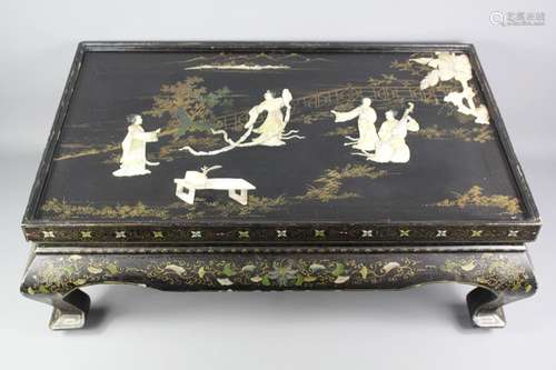 Japanese Lacquer Shibayama Low Table; the tabletop worked with mother-of-pearl in relief, showing a figure dancing to a musician playing a Shamisen, gilt decorations to sides of table, approx 82 x 52 x 31 cms