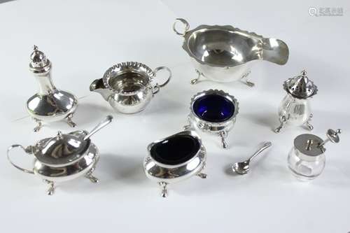 Miscellaneous silver; including a cruet trio, three further mustards (one clear glass with spoon), the other two with blue glass liners, silver handled soft brush, boxed cruet set, silver handled button hook together with a brass stamp box approx 8 x 6 x 3