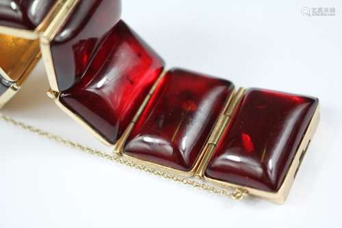 Vintage 14ct gold and red amber bracelet, the bracelet made with ten segmented panels set with polished amber rectangular cameo approx 25 x 18mm each, the length approx 20 mm, approx 50 gms