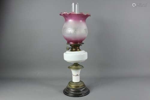 A Victorian oil lamp, with white glass reservoir and lilac etched fluted shade, approx 59 cms