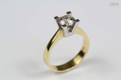 An 18ct yellow and white gold solitaire diamond ring, the diamond in an elegant setting approx 75 pts, size N, approx 5