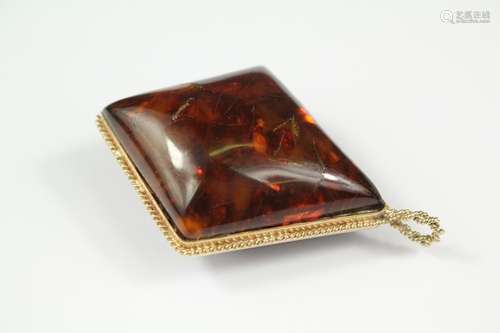 Antique red and yellow amber pendant, the pendant having good inclusions and set in a 9ct yellow gold wire-form mount