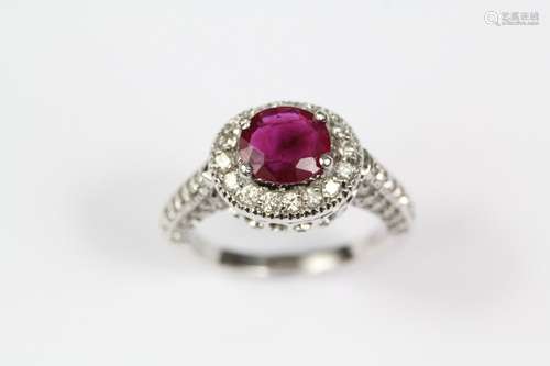 An 18ct white gold pigeon-blood ruby and diamond ring, the cushion-cut ruby approx 6 x 7