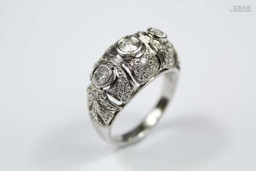 A Lady's Platinum and Diamond Russian Dress Ring, the ring set with 1 x 18 pts and 2 x 16pts of dias, on a fretwork floral mount and further set with 55 pts of pave-set dias, size N, approx 8