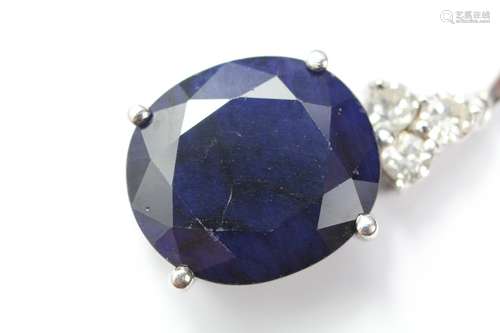 An 14ct white gold and midnight blue sapphire and diamond pendant, the oval sapphire approx 15 x 13 x 6mm, set with three diamonds approx 30 pts, approx 4