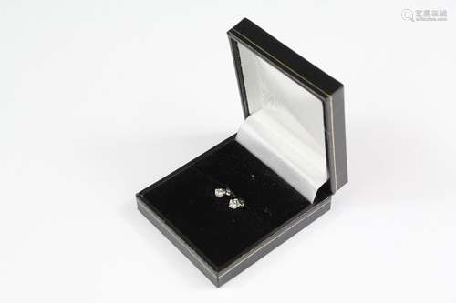 Pair of diamond solitaire ear studs, 18ct gold scrolls and silver posts and setting, contained in a white box