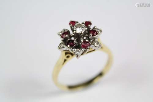 An 18ct yellow gold ruby and diamond ring, set with center diamond approx 14 pts, 6 x 2