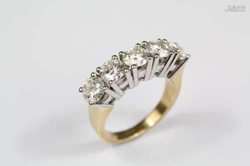 An 18ct yellow and white stone ring