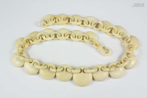 Late 19th century carved ivory necklace, carved with graduated chain and disc design, approx 45 cms l