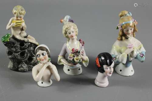 Continental porcelain figurines, including three powder pots and covers; five hat pin holders and three porcelain pin cushions in the form of women