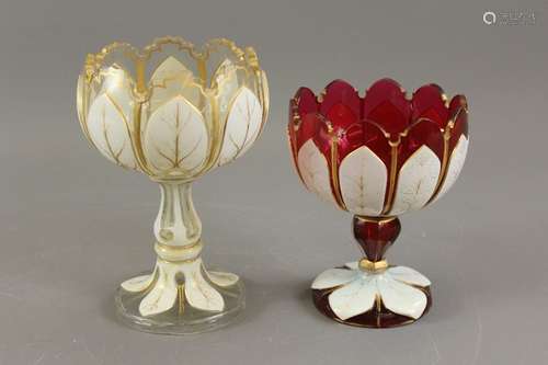 Two glass and enamel goblet vases; the first being a Cranberry glass vase with leaf-shaped bowl and leaf decoration to stem and base, approx  16