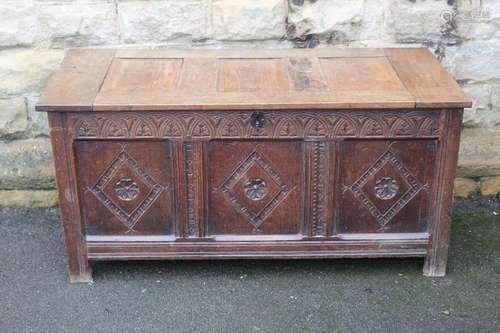 Antique oak coffer, with a carved panelled front, approx 124w x 54 x 63 cms