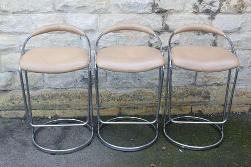 Boss Design Ltd - three beige leather bar stools; the stools raised on chrome supports (3)