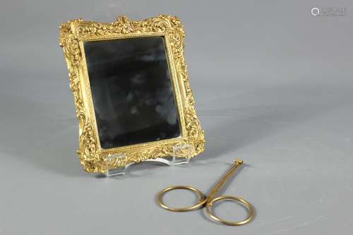 Antique Continental Ormolu mirror, with foliate decoration to the frame, (pin missing from rear support), approx 10 x 22 cms