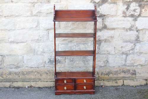 Mahogany Victorian bookcase, with fretwork supports, having three shelves with four drawers beneath, approx 50 x 18 x 113 cms