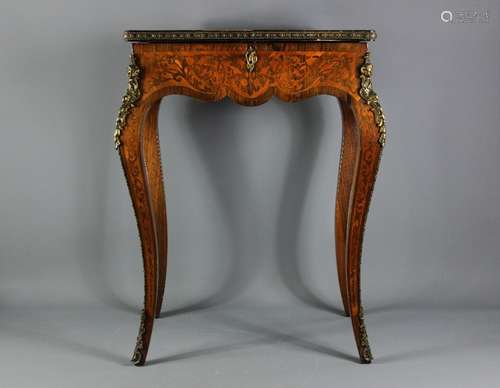 19th Century Louis XVI-style sewing table; the rosewood and kingwood inlaid sewing table, having a hinged topped which opens to reveal a fitted interior, supported on sabre legs with ormolu mounts, approx 55 x 37 x 75 cms