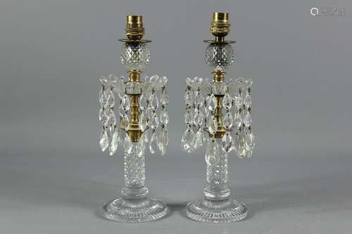 A Pair of Victorian cut-glass lustres; the lustres wired for electricity, approx 11 x 33 cms h (to top of fitting)