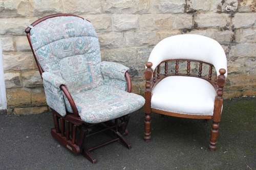 A Dutailier Rocking Chair; the chair and arms having green patterned fabric covering together with a tub chair having padded seat and backrest with turned supports