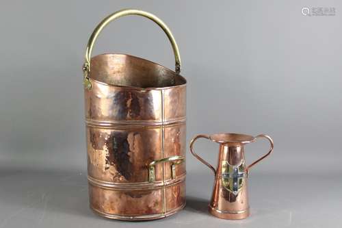 Antique copper and brass coal scuttle, together with an Arts and Crafts vase, twin handled vase with a shield, approx 19 cms h