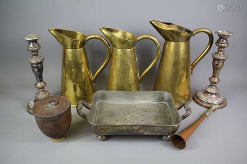 Three graduated brass cider jugs, together with a quantity of silver plate including serving dish warmers and a pair of candlesticks