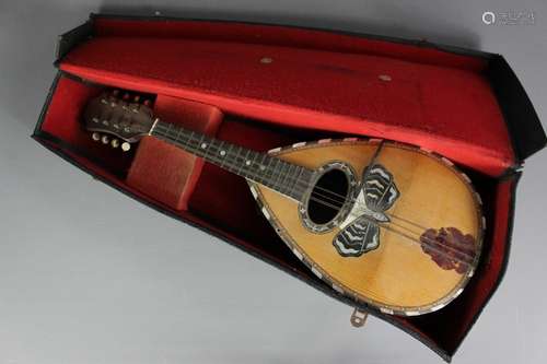 A vintage Italian Napoli Mandolin, in the original case together with British-made Ukulele, housed in the original box