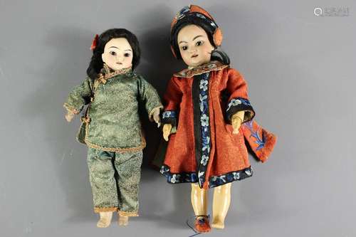 Two antique wood carved South Asian dolls