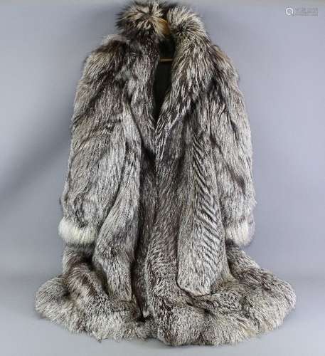 Full length silver fox fur coat, the coat labelled SAGA Fox and Superb Ranched Fur made in Italy, button to top with three front fastenings, a large size, approx 110 cms in length