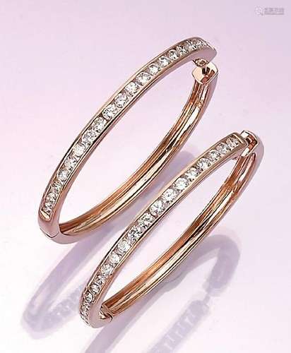 Pair of big 14 kt gold hoop earrings with brilliants