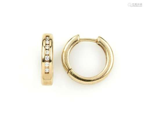 Pair of 14 kt gold CHRIST hoop earrings with brilliants