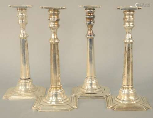 Set of Four Sterling Silver Candlesticks, weighted.