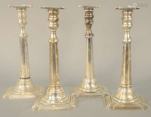 Set of Four Sterling Silver Candlesticks, weighted.