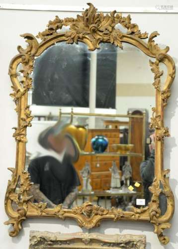 A Louis XV/XVI Transitional Carved Giltwood Mirror,