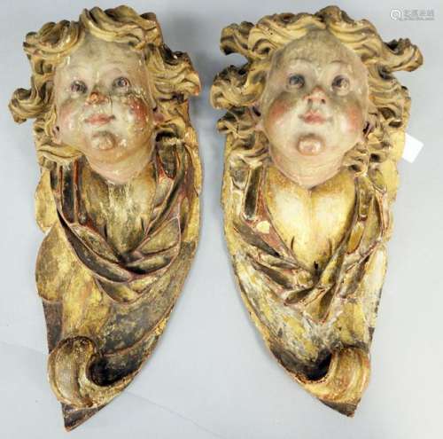 Pair of Carved Putti Faces, with original polychrome