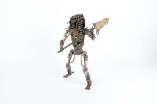 After the 1987 film Predator, a figure constructed from car and bike parts, weapon included,