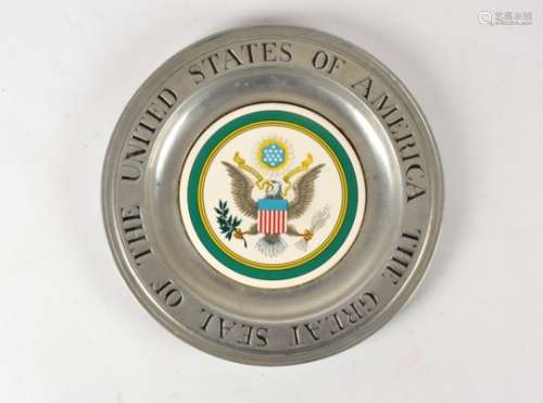 An American pottery and pewter dish, E Pluribus Unum' with the eagle motif, marked to the base for