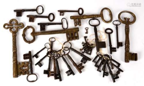 A large collection of antique and later door and padlock keys, all metal and of various sizes and
