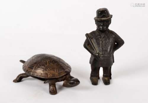 A quirky cast iron turtle figure with ringing bell function, length 18.5cm, together with a
