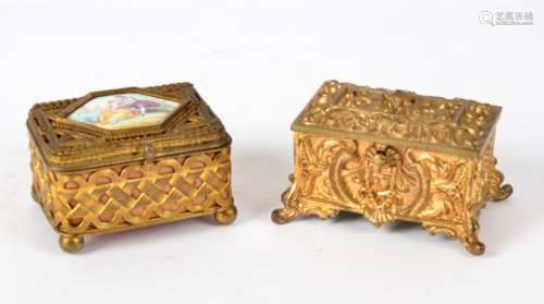 A 'Go to Bed' box with lined red interior, raised on four scrolling feet, with classical decoration,