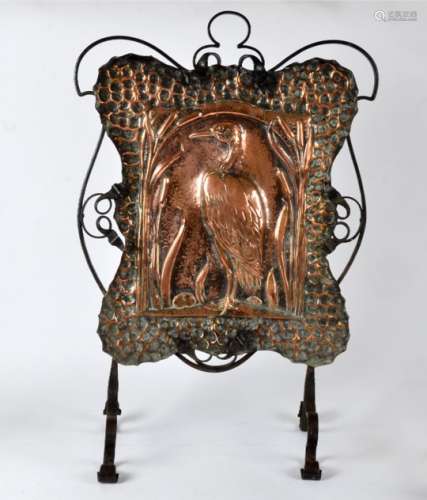 An Arts & Crafts copper fire screen, the central motif being a crane, popular in the Eastern