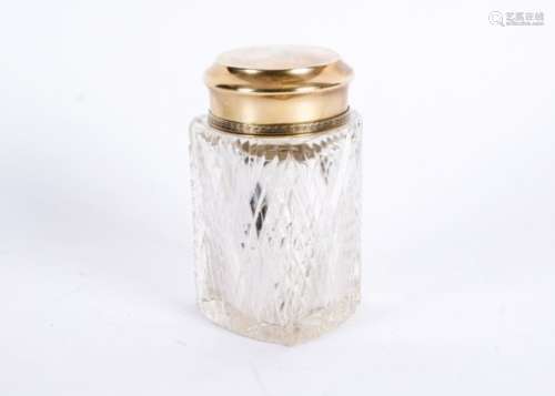 A silver topped Russian glass bottle, the cut glass body of triangular shape, height 14.5cm