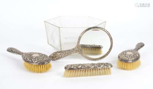 A hallmarked silver dressing table set, consisting of three brushes, and one mirror, all
