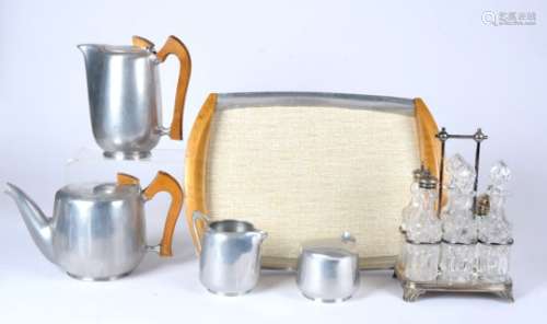 A silver plated cruet set, together with a picquet mid Century set, height of tallest pot 20cm and a