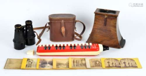A stereoscope viewer and cards, mostly of topographical interest, together with a pair of