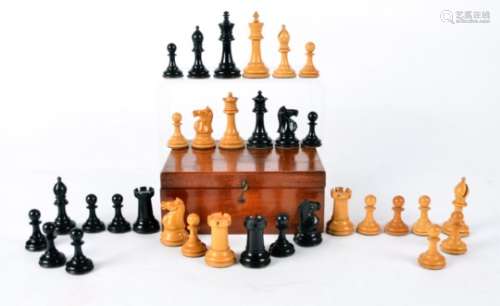 A Staunton chess set in box, with red crown monograms, one piece a/f but present, complete set